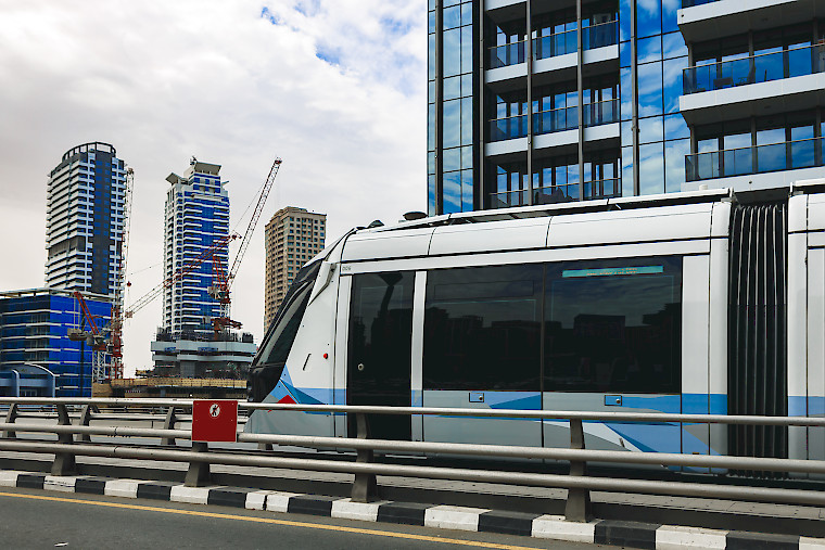 A moving train as seen from an elevated station