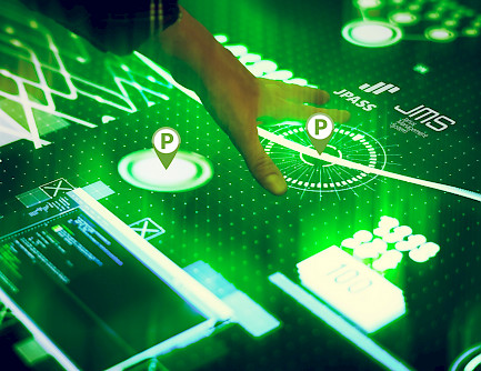 an expert hand touches an interactive panel with parking placeholders