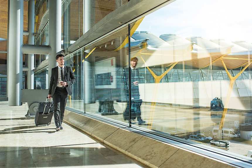 Young businessman walking at the airport terminal